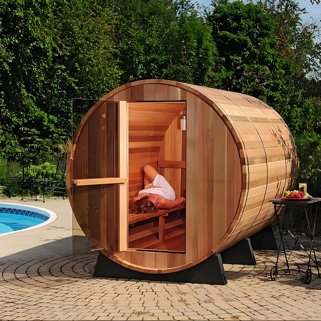 Custom - made outdoor barrel - shaped sauna for 4 - 6 people. It is a steam sauna made of Canadian red cedar, equipped with an electric heater and sauna stones. Hover Image