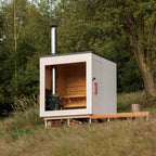 A modern - designed bathroom cedar sauna with a square fir cube shape, heated by an electric furnace.